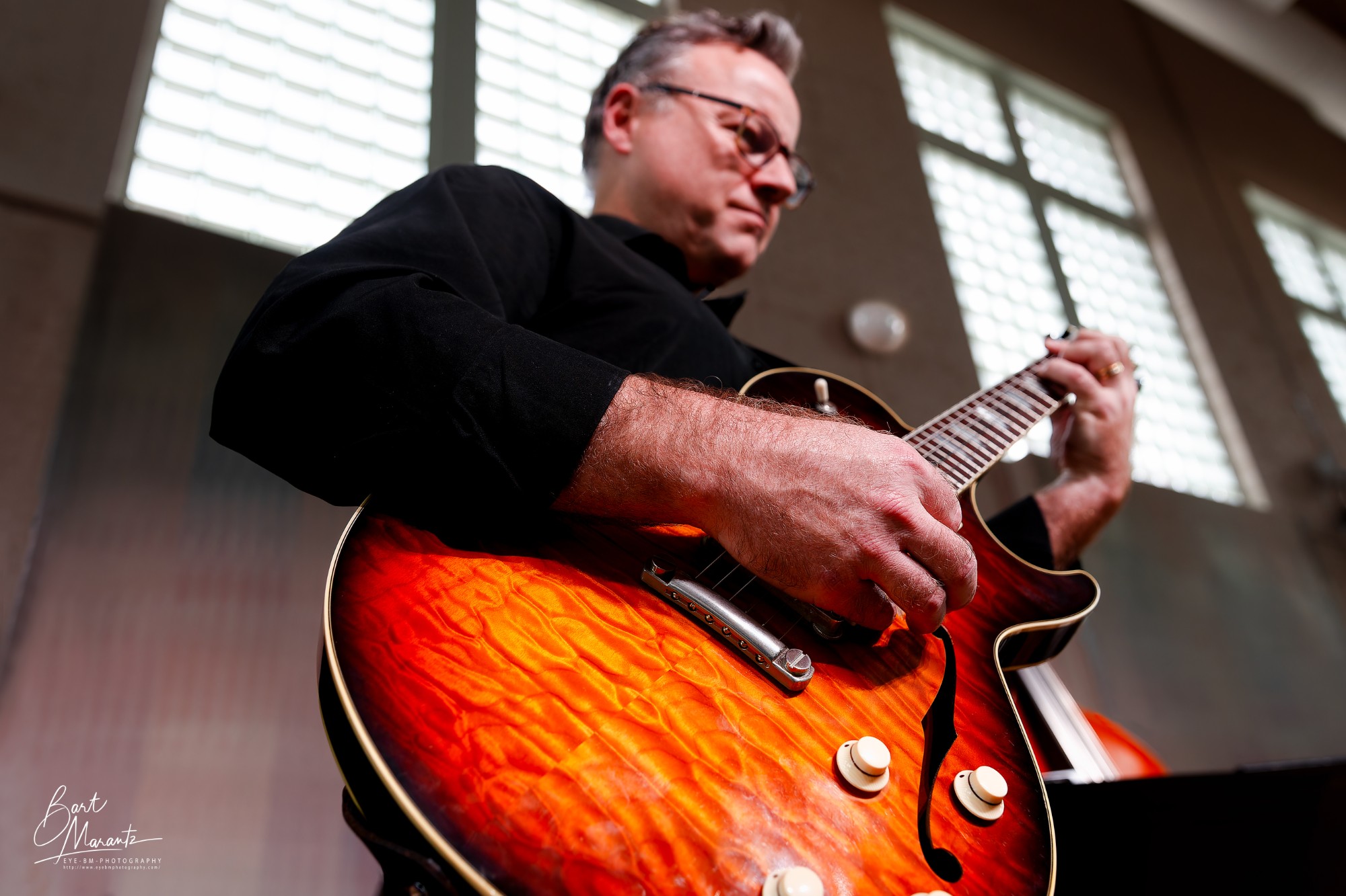 Noel Johnston playing a sunburst semi-hollow guitar
